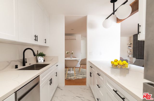 a spacious bathroom with a sink a mirror and a bathtub
