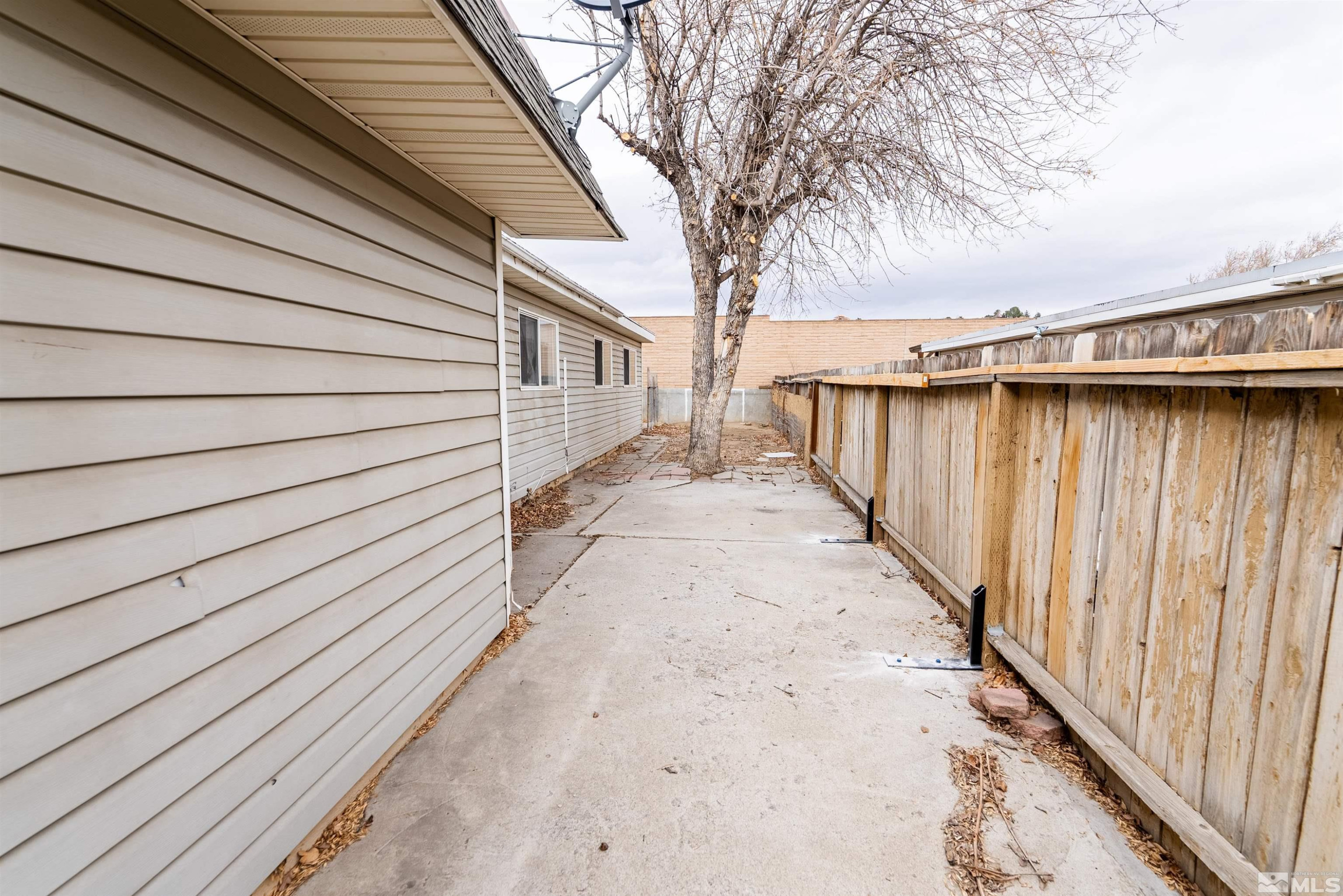 1640 Gault Way Sparks, NV 89431 - Photo 15 of 15 a view of a backyard with wooden fence