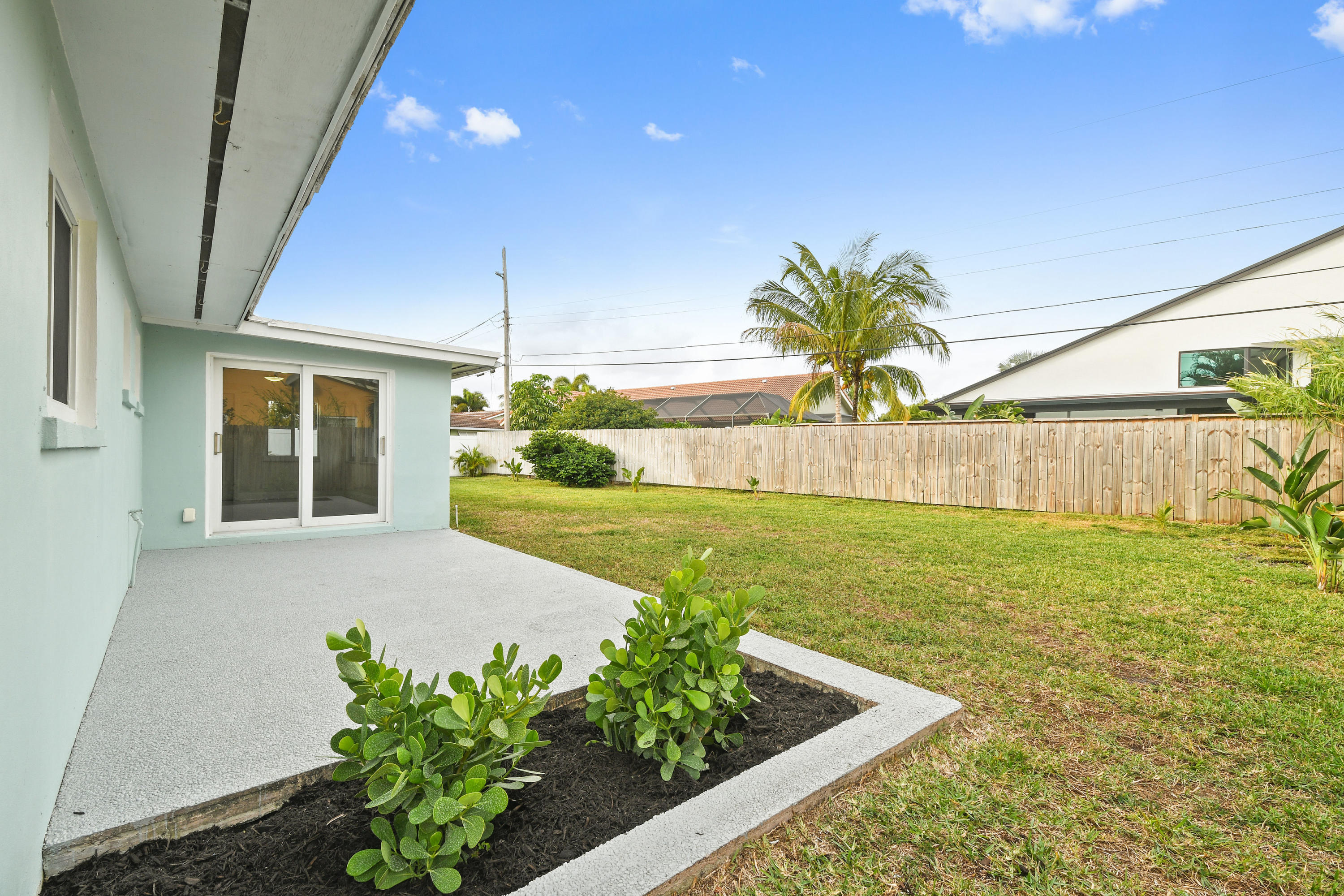 2003 Park Place Boca Raton, FL 33486 - Photo 40 of 42 a view of a house with a garden