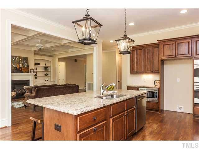 913 Keith Road Wake Forest, NC 27587 - Photo 11 of 25 Open Entertaining Flow With Wall Of Windows And Access To Covered Porch. Island Seating And Beautiful Custom Cabinets. Stainless Steel Appliances.