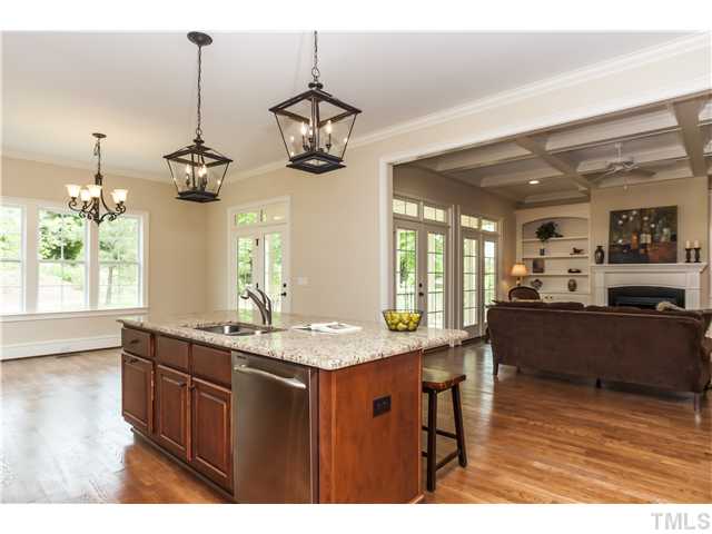 913 Keith Road Wake Forest, NC 27587 - Photo 25 of 25 Casual Island Seating And A Wonderful Open Floor Plan. Gleaming Hardwood Floors, Double Oven, Built-in Microwave and Designer Tile Back Splash, Exotic Granite Counters. Private Landscaped Back Yard.