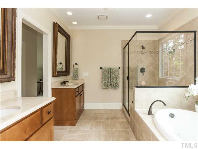 913 Keith Road Wake Forest, NC 27587 - Photo 14 of 25 Designer Tile And Accents In The Oversized Shower, Relaxing Tub, Dual Vanities And Custom Mirrors. This Beautiful Master Bath Is A Wonderful Way To Begin And End Your Day.