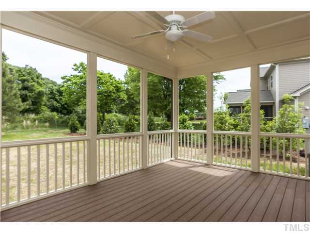 913 Keith Road Wake Forest, NC 27587 - Photo 20 of 25 Wall Of Windows Looking Out Onto The Screen Porch. Custom Trim Detailing On The Ceiling And Private Back Yard.