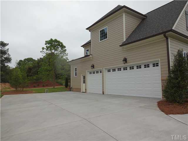 913 Keith Road Wake Forest, NC 27587 - Photo 21 of 25 Spacious Three Car Garage And Plenty Of Room For Parking. Large Private Back Yard.