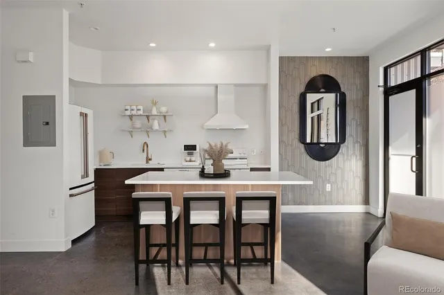 a dining room with furniture a window and a chandelier