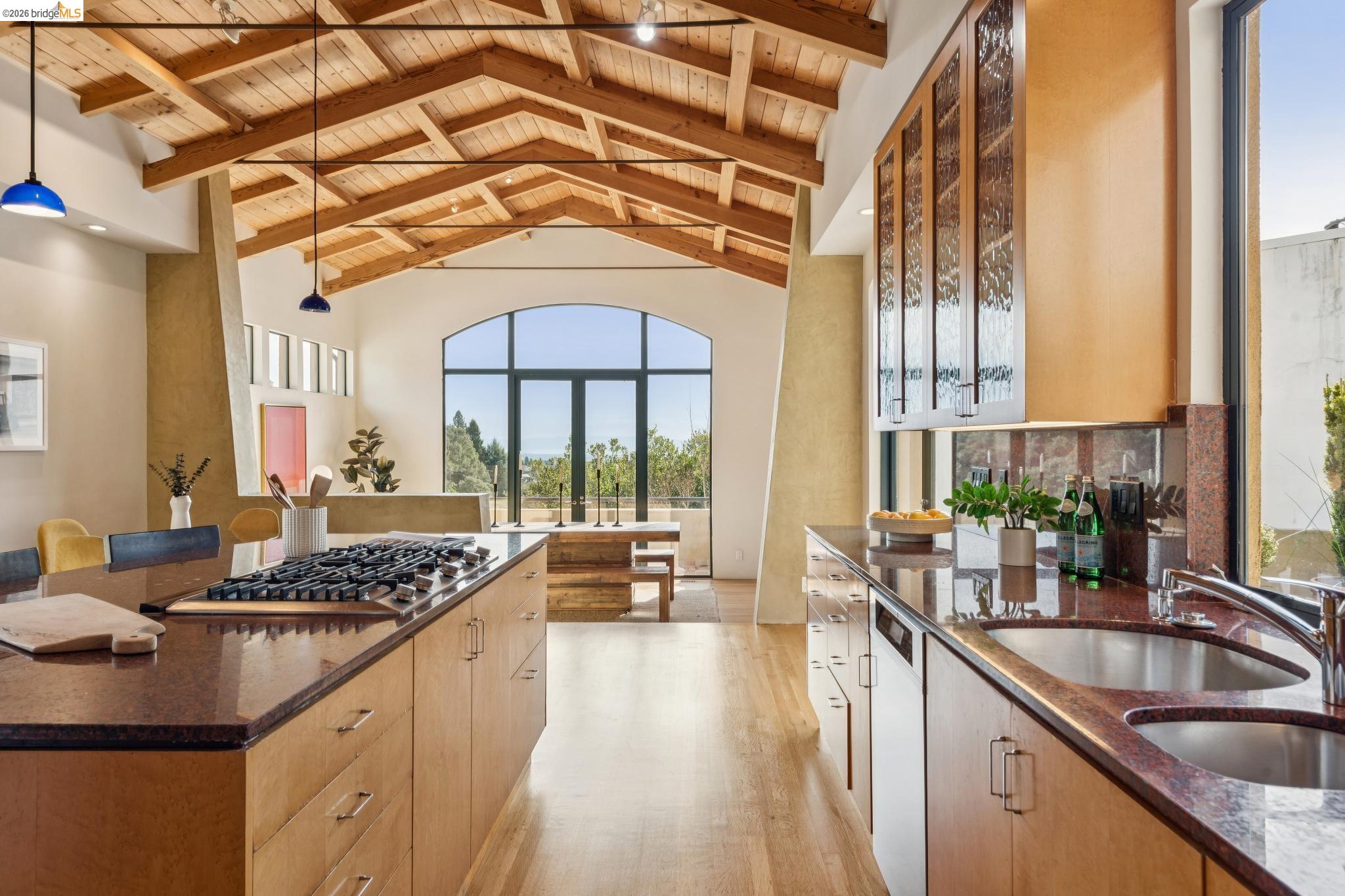 150 Vicente Road Berkeley, CA 94705 - Photo 15 of 54 a kitchen with stainless steel appliances granite countertop a sink a stove and a wooden cabinets
