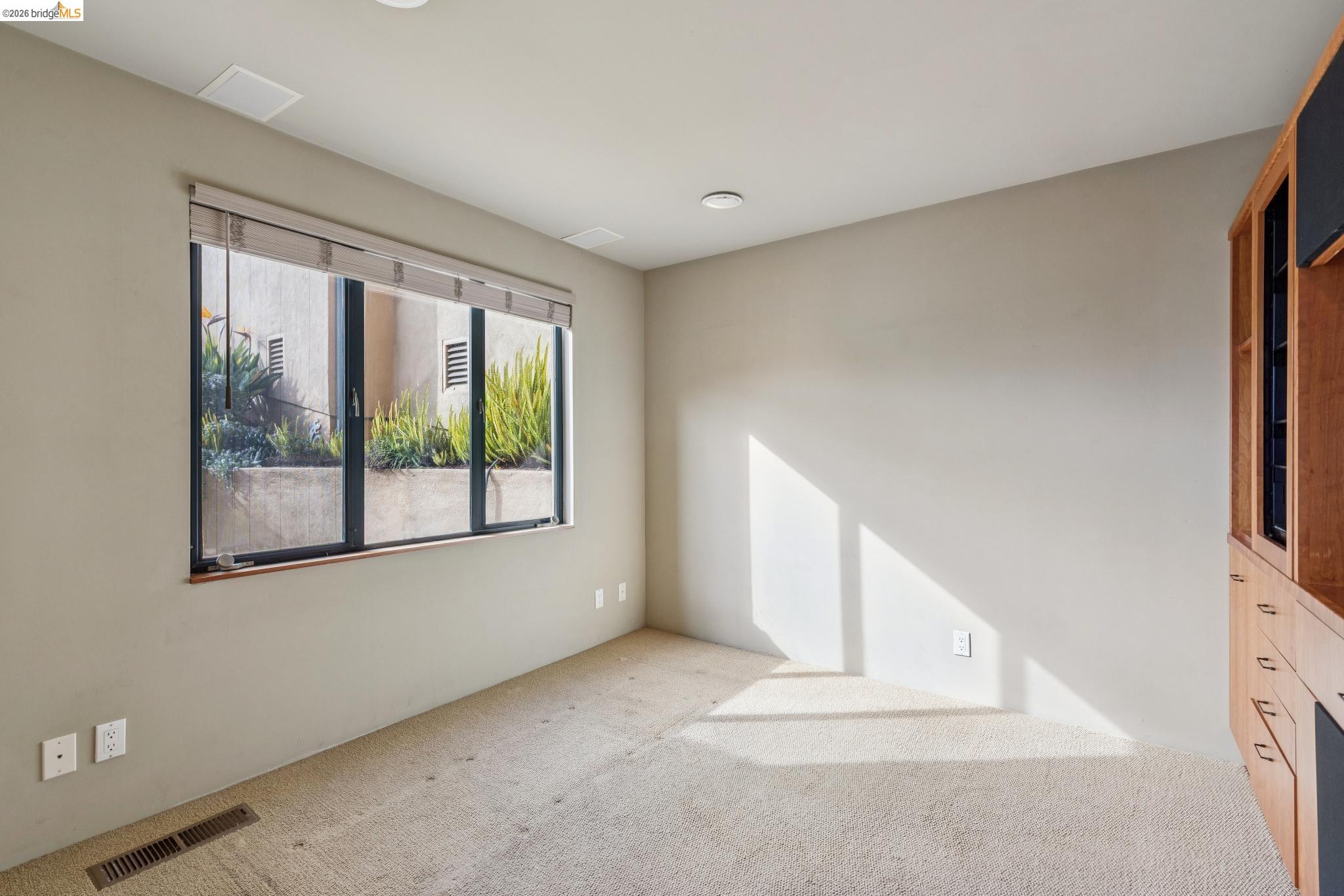 150 Vicente Road Berkeley, CA 94705 - Photo 23 of 54 a view of empty room with window