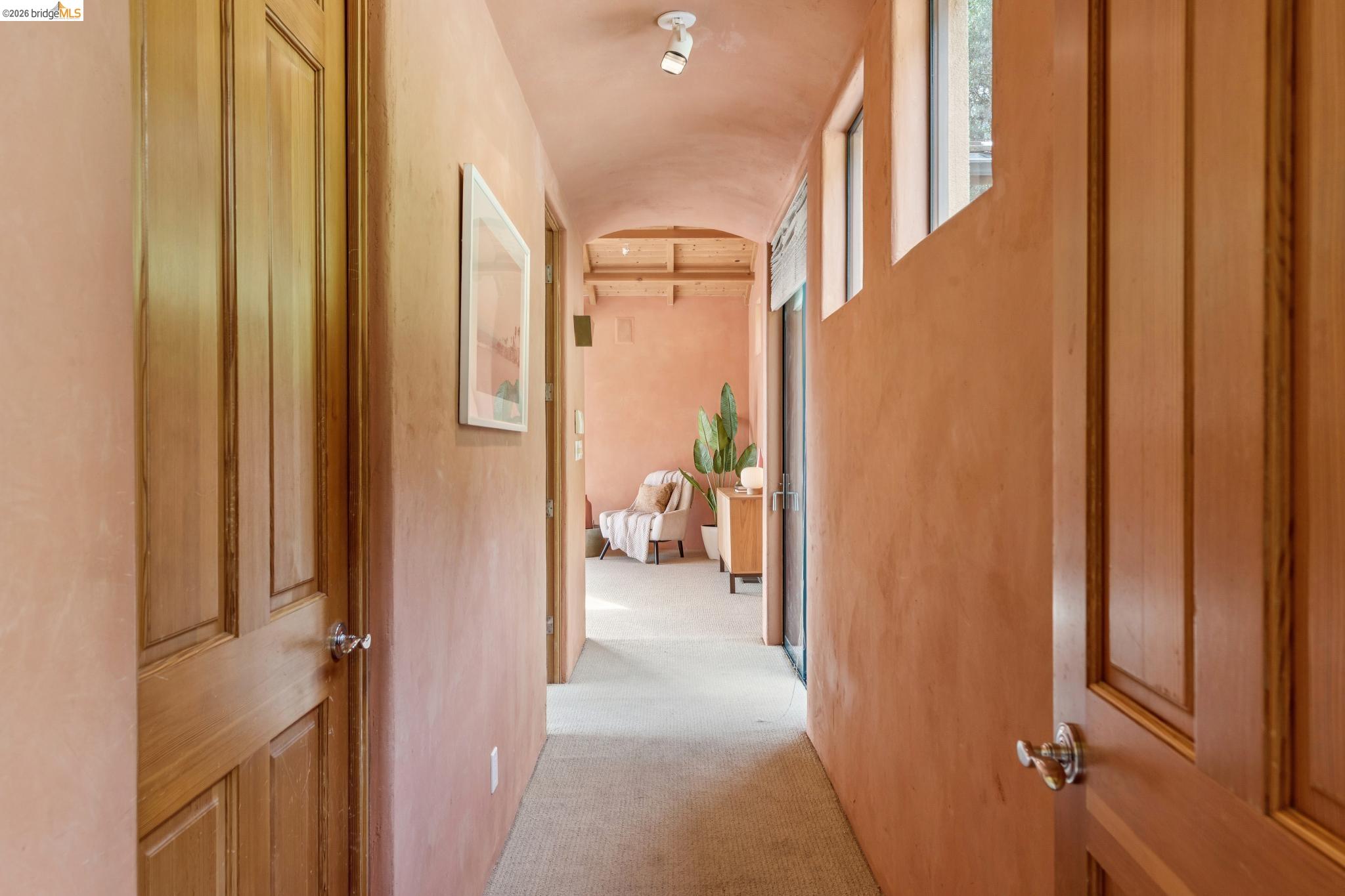 150 Vicente Road Berkeley, CA 94705 - Photo 28 of 54 a view of a hallway with large windows and couches