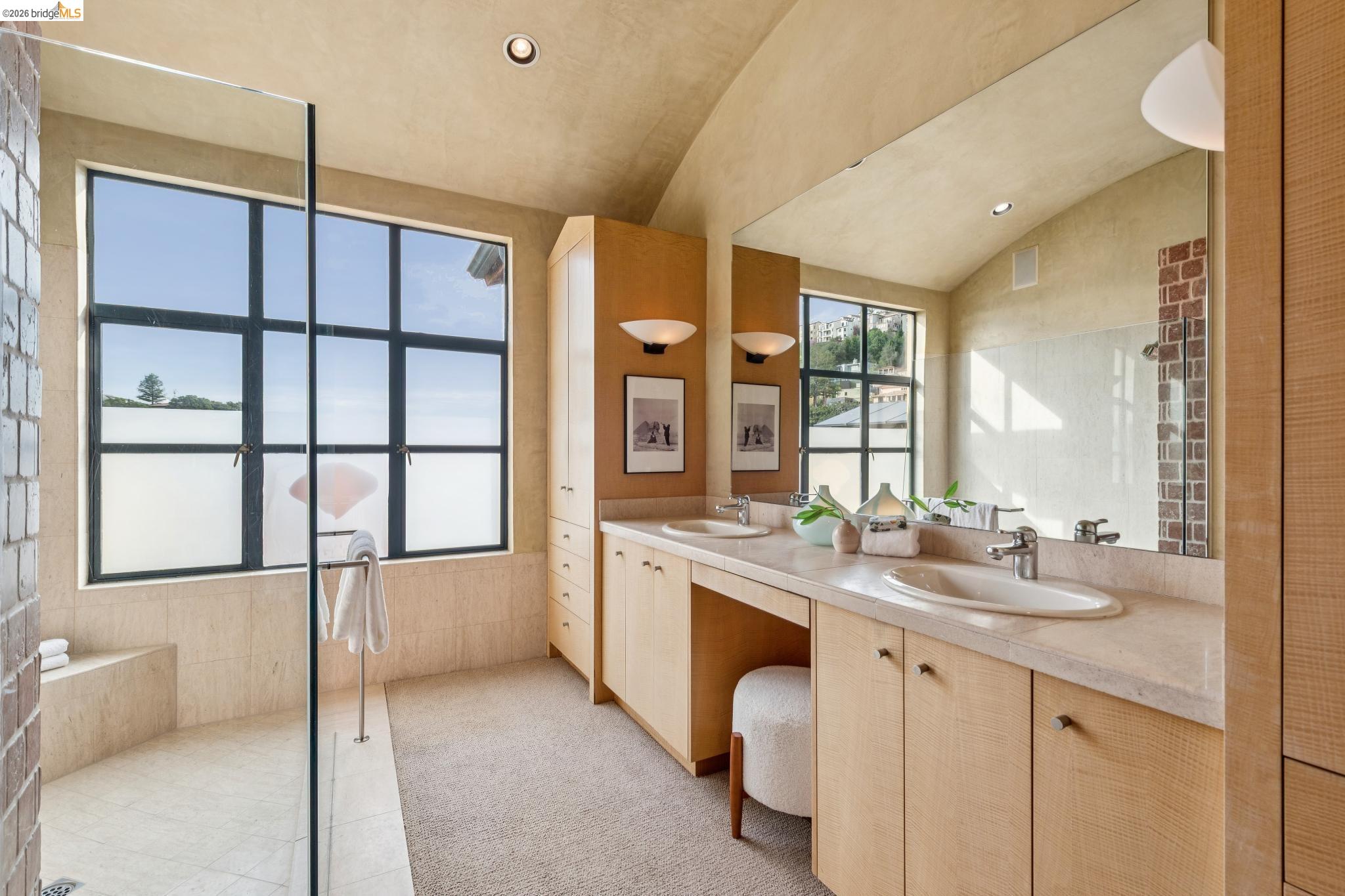 150 Vicente Road Berkeley, CA 94705 - Photo 31 of 54 a bathroom with a double vanity sink and a mirror