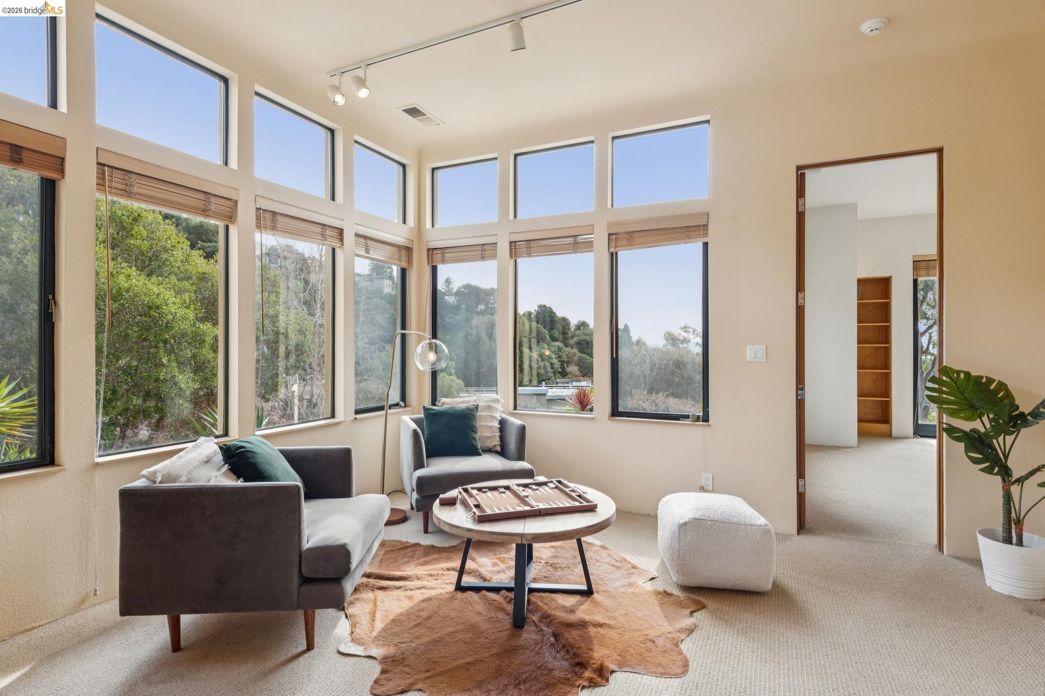 150 Vicente Road Berkeley, CA 94705 - Photo 38 of 54 a living room with furniture and a large window
