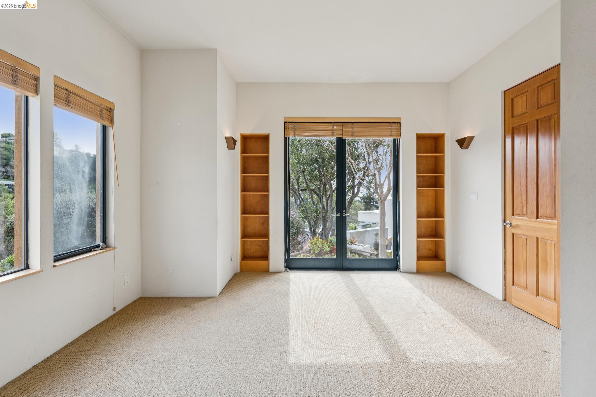 150 Vicente Road Berkeley, CA 94705 - Photo 40 of 54 a view of an empty room with glass door and balcony