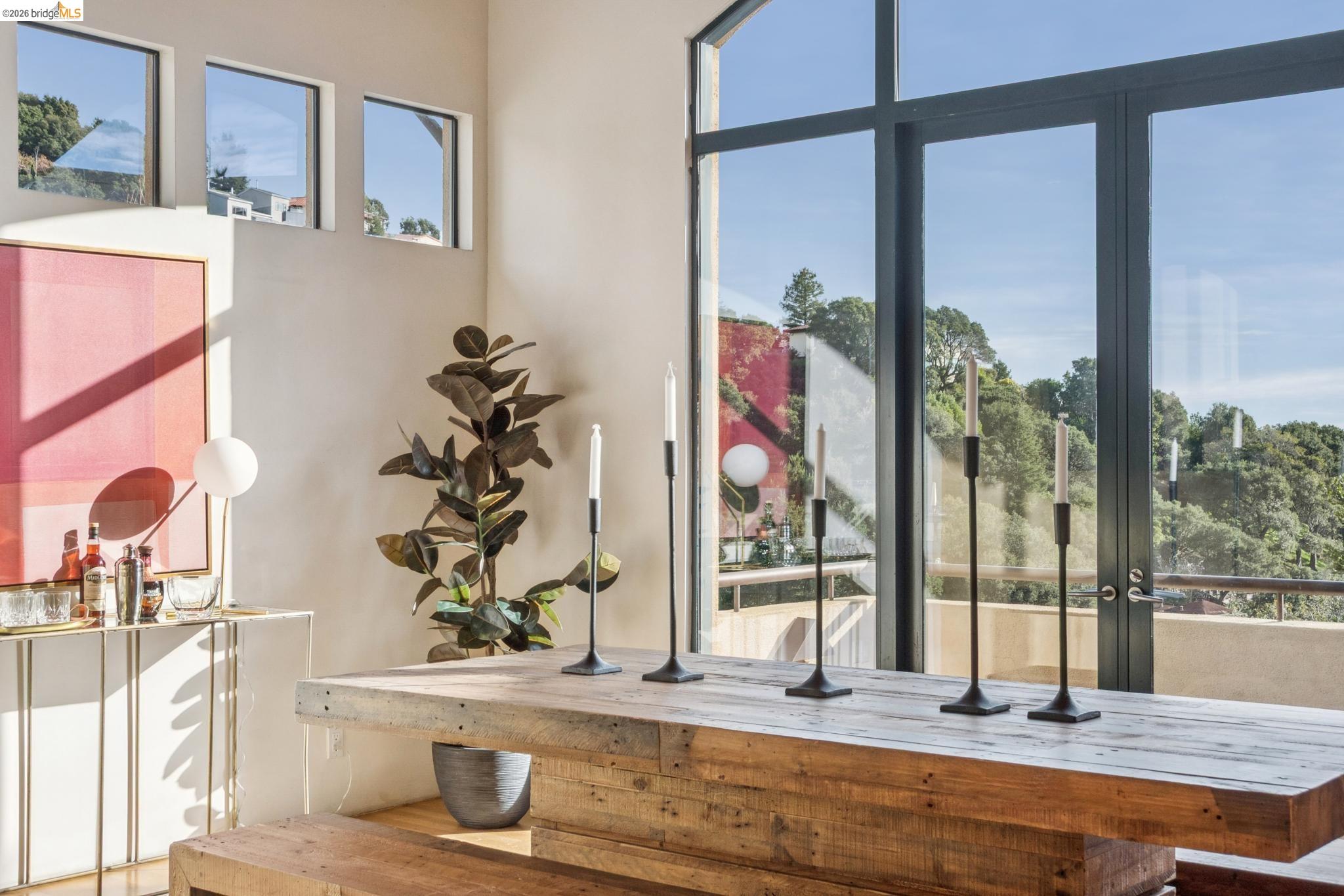 150 Vicente Road Berkeley, CA 94705 - Photo 44 of 54 a view of living room with a floor to ceiling window and potted plant