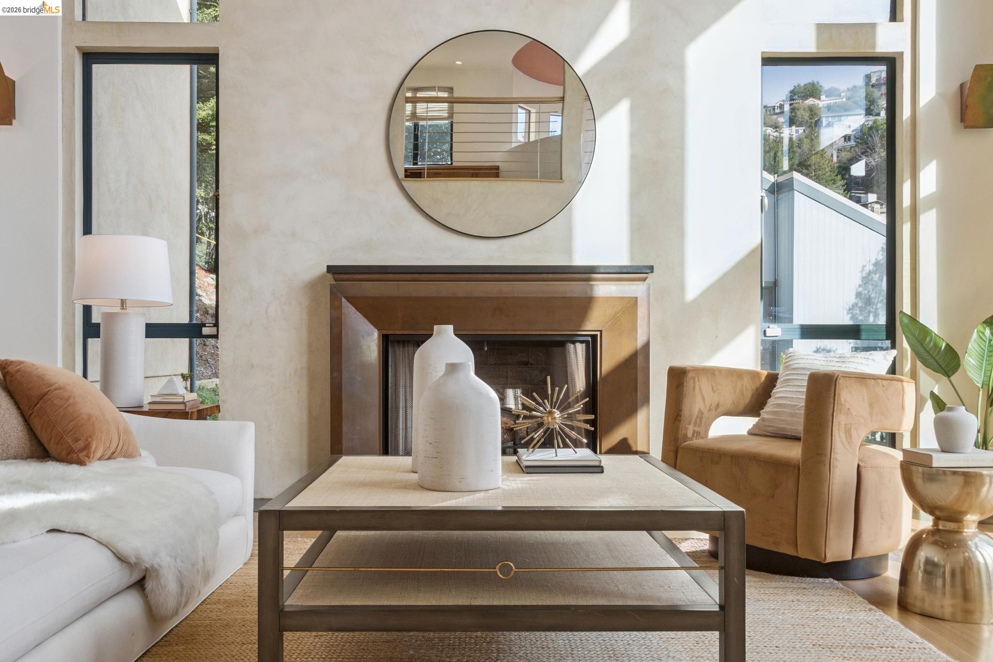 150 Vicente Road Berkeley, CA 94705 - Photo 10 of 54 a living room with furniture a mirror and a fireplace