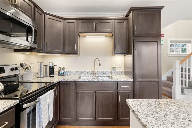 a view of bathroom with a toilet sink and mirror