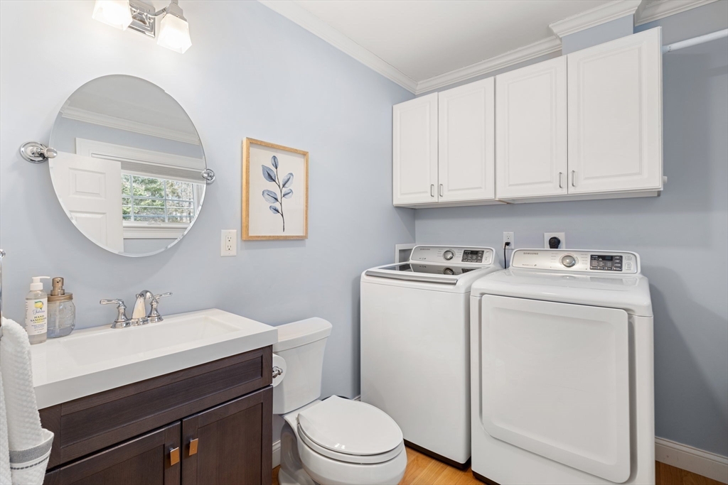 48 Boston Road, Unit A Groton, MA 01450 - Photo 12 of 22 a view of bathroom with a toilet sink and mirror