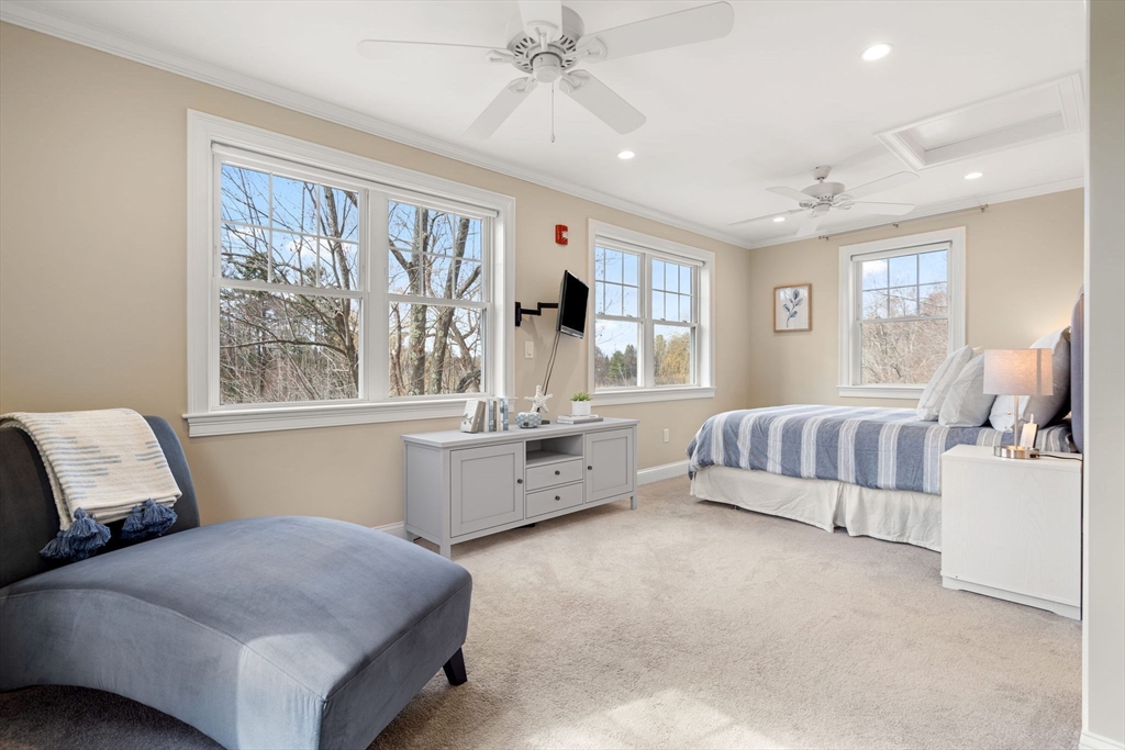 48 Boston Road, Unit A Groton, MA 01450 - Photo 17 of 22 a bedroom with a large bed and a window