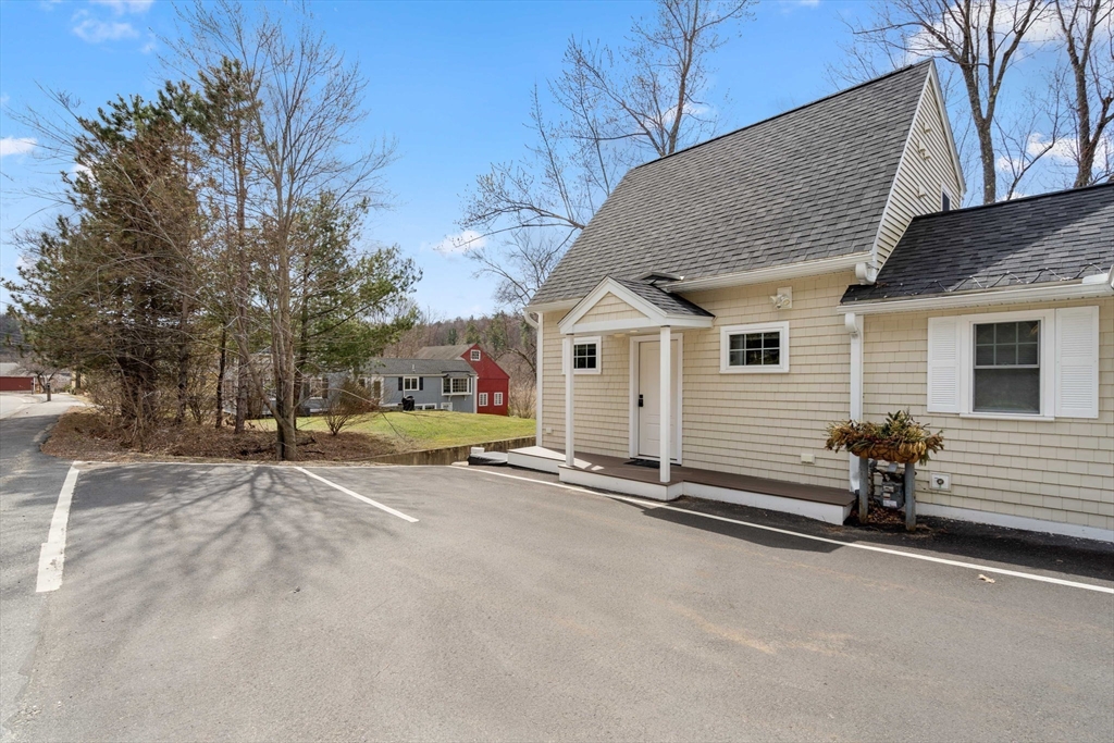 48 Boston Road, Unit A Groton, MA 01450 - Photo 20 of 22 a view of a house with a patio