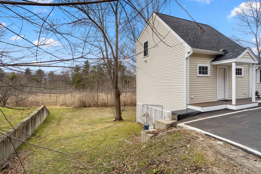 48 Boston Road, Unit A Groton, MA 01450 - Photo 21 of 22 a backyard of a house