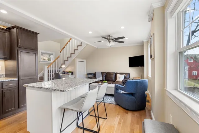 a living room with granite countertop furniture and fireplace