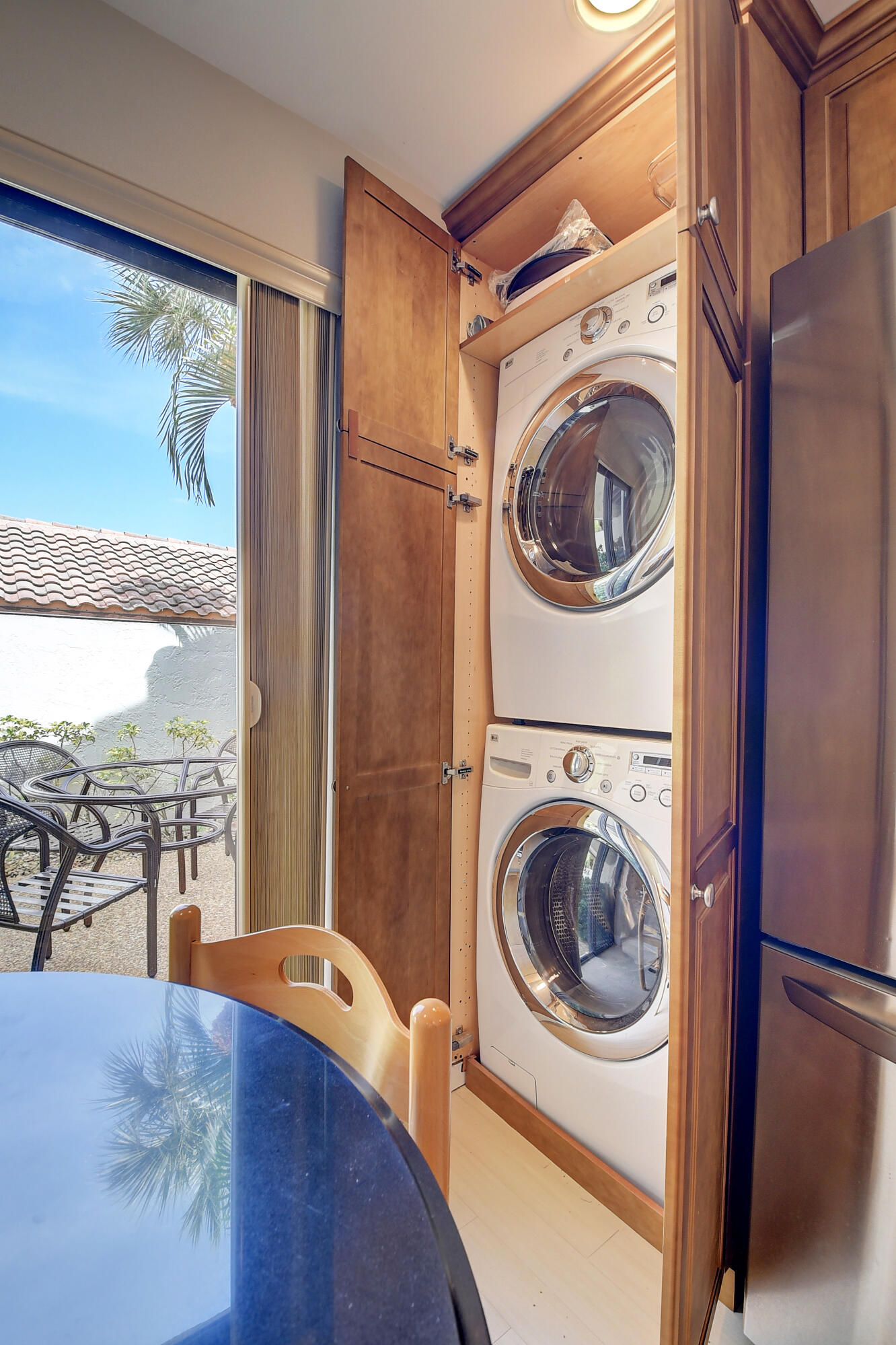 7900 Granada Place, Unit 1103 Boca Raton, FL 33433 - Photo 21 of 56 Washer & Dryer in custom kitchen cabinet