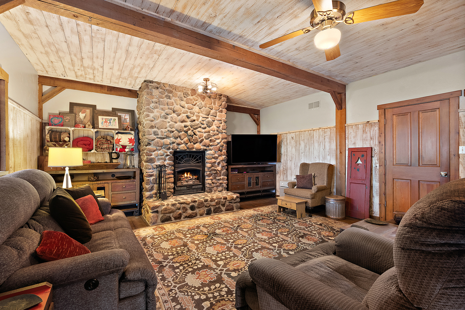 7860 West Steger Road Frankfort, IL 60423 - Photo 12 of 56 a living room with furniture a flat screen tv and a fireplace