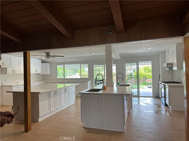 a kitchen with counter top space and stainless steel appliances