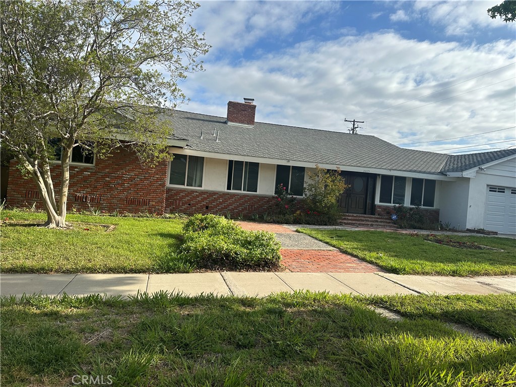 3025 East Hillcrest Avenue Orange, CA 92867 - Photo 6 of 6 a front view of a house with a yard
