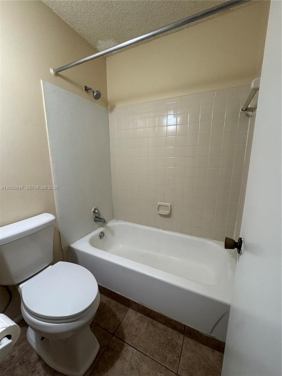 4401 West McNab Road, Unit 30 Pompano Beach, FL 33069 - Photo 13 of 23 a bathroom with a toilet and a bathtub