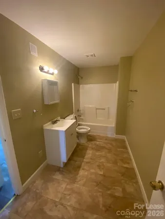 a view of a bathroom with sink and a mirror