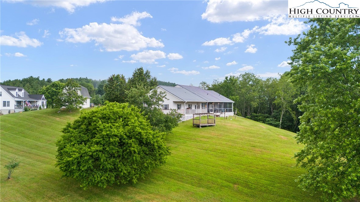 175 Olive Ridge Drive Crumpler, NC 28617 - Photo 40 of 50 a view of a house with a big yard