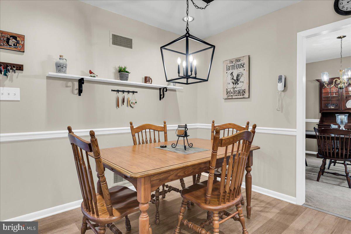 2575 West Colonial Drive Upper Chichester, PA 19061 - Photo 10 of 42 a view of a dining room with furniture and wooden floor