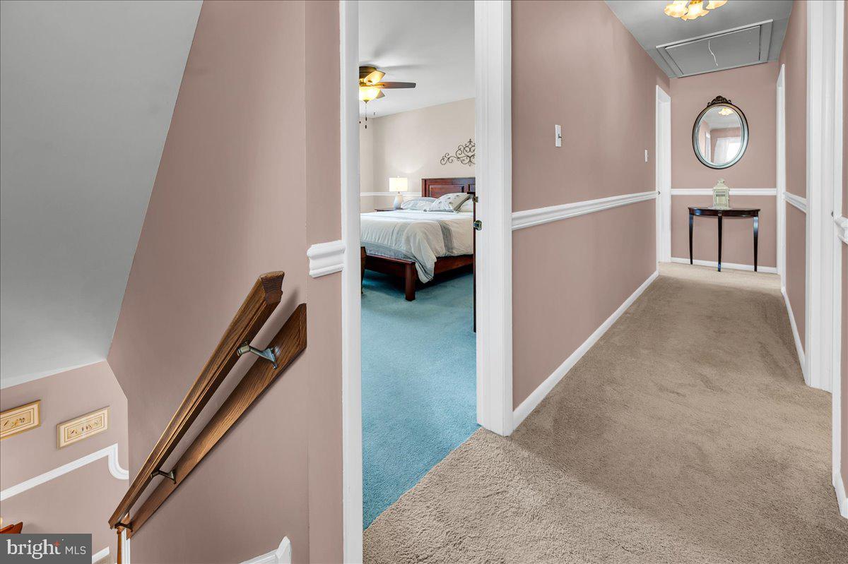 2575 West Colonial Drive Upper Chichester, PA 19061 - Photo 16 of 42 a view of a hallway to a livingroom and a hall with wooden floor