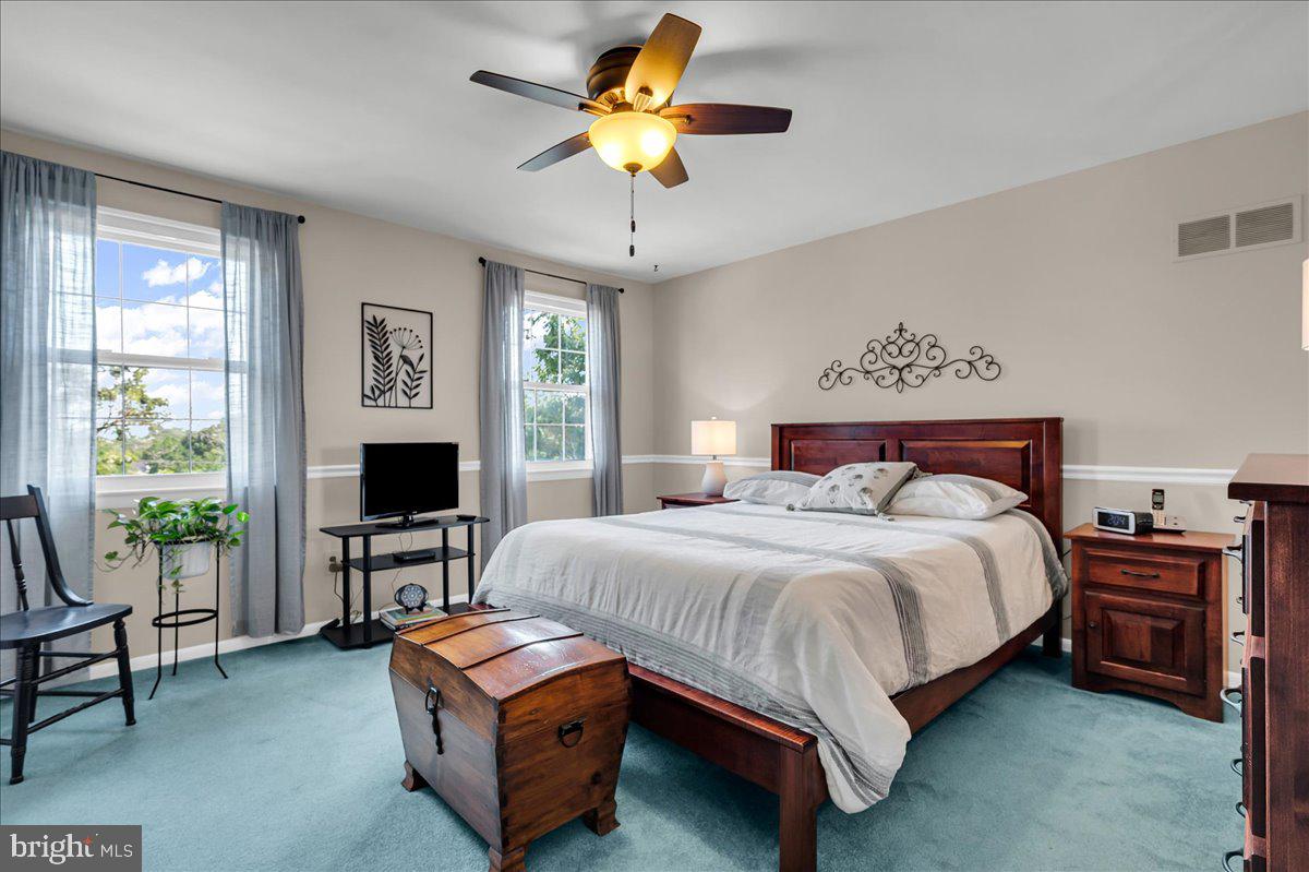 2575 West Colonial Drive Upper Chichester, PA 19061 - Photo 20 of 42 a bedroom with a bed and a chandelier