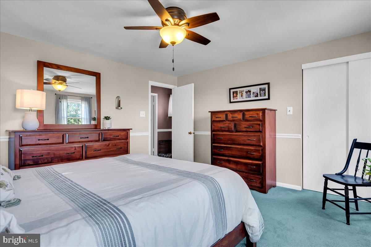 2575 West Colonial Drive Upper Chichester, PA 19061 - Photo 21 of 42 a bedroom with a bed and a chandelier