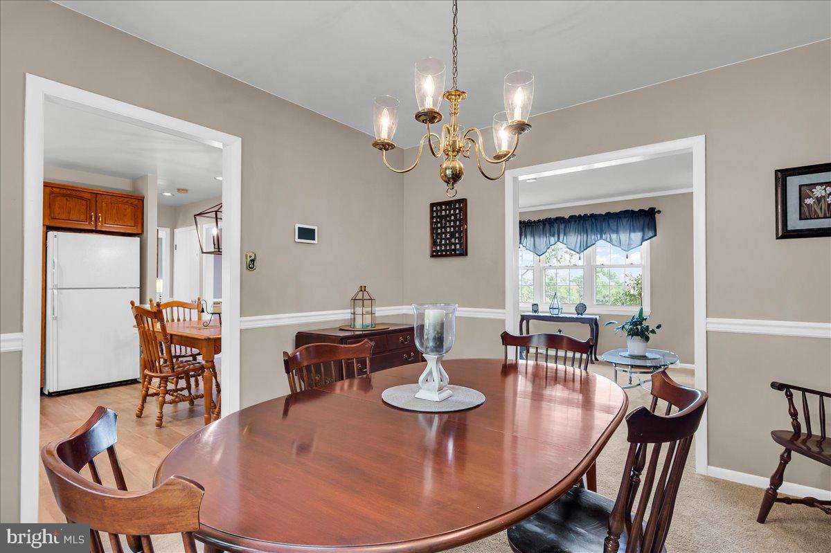 2575 West Colonial Drive Upper Chichester, PA 19061 - Photo 42 of 42 a view of a dining room with furniture window and wooden floor