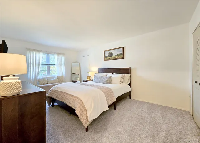 a bed room with a bed and a table