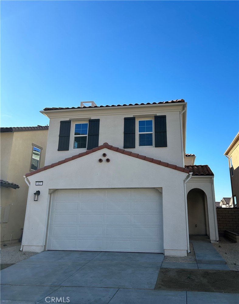 a front view of a house with yard