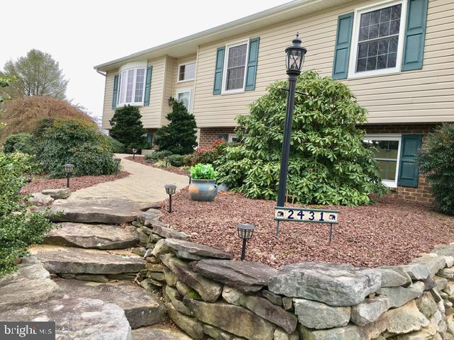 CUSTOM STONE WALL & WALKWAY GIVE STATELY ELEGANCE