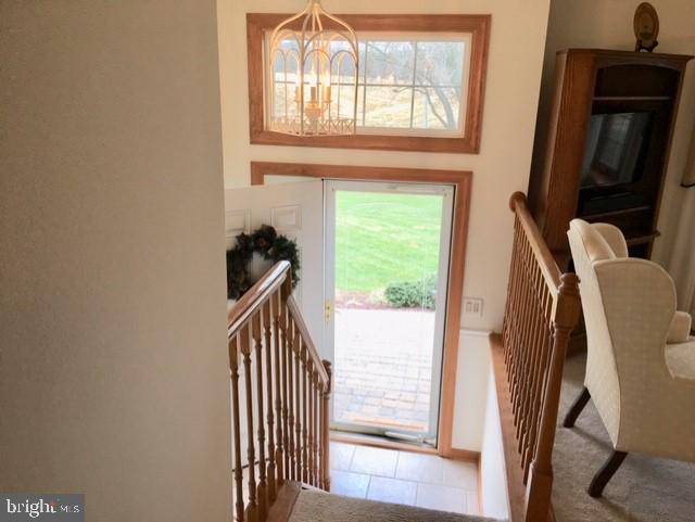 INVITING FOYER WELCOMES YOU HOME AFTER A DAYS WORK