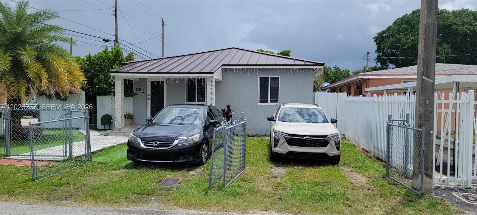 301 Southwest 36th Avenue Miami, FL 33135 - Photo 4 of 32 a front view of a house with garden