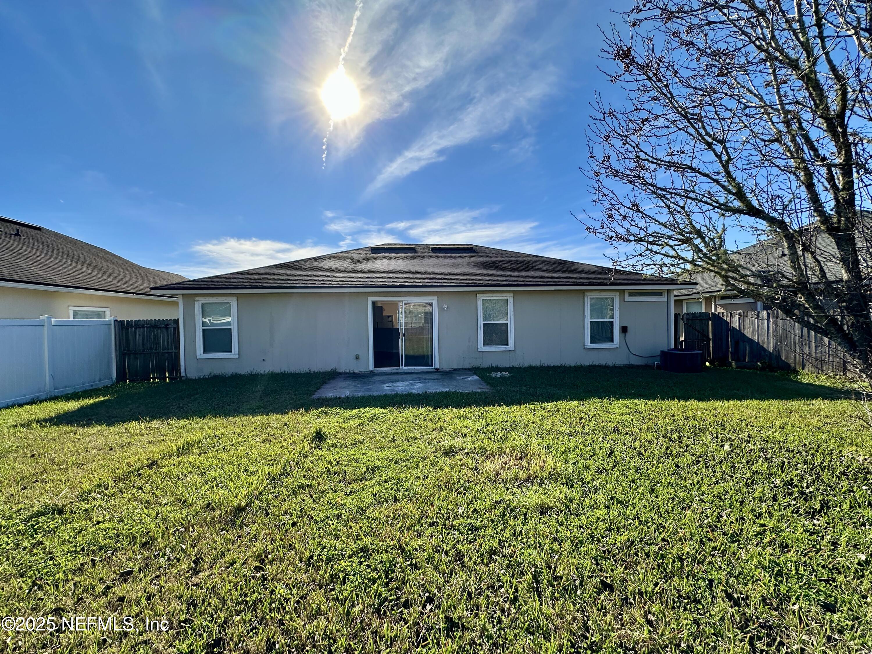 45575 Ingleham Circle Callahan, FL 32011 - Photo 21 of 24 a view of a house with a big yard