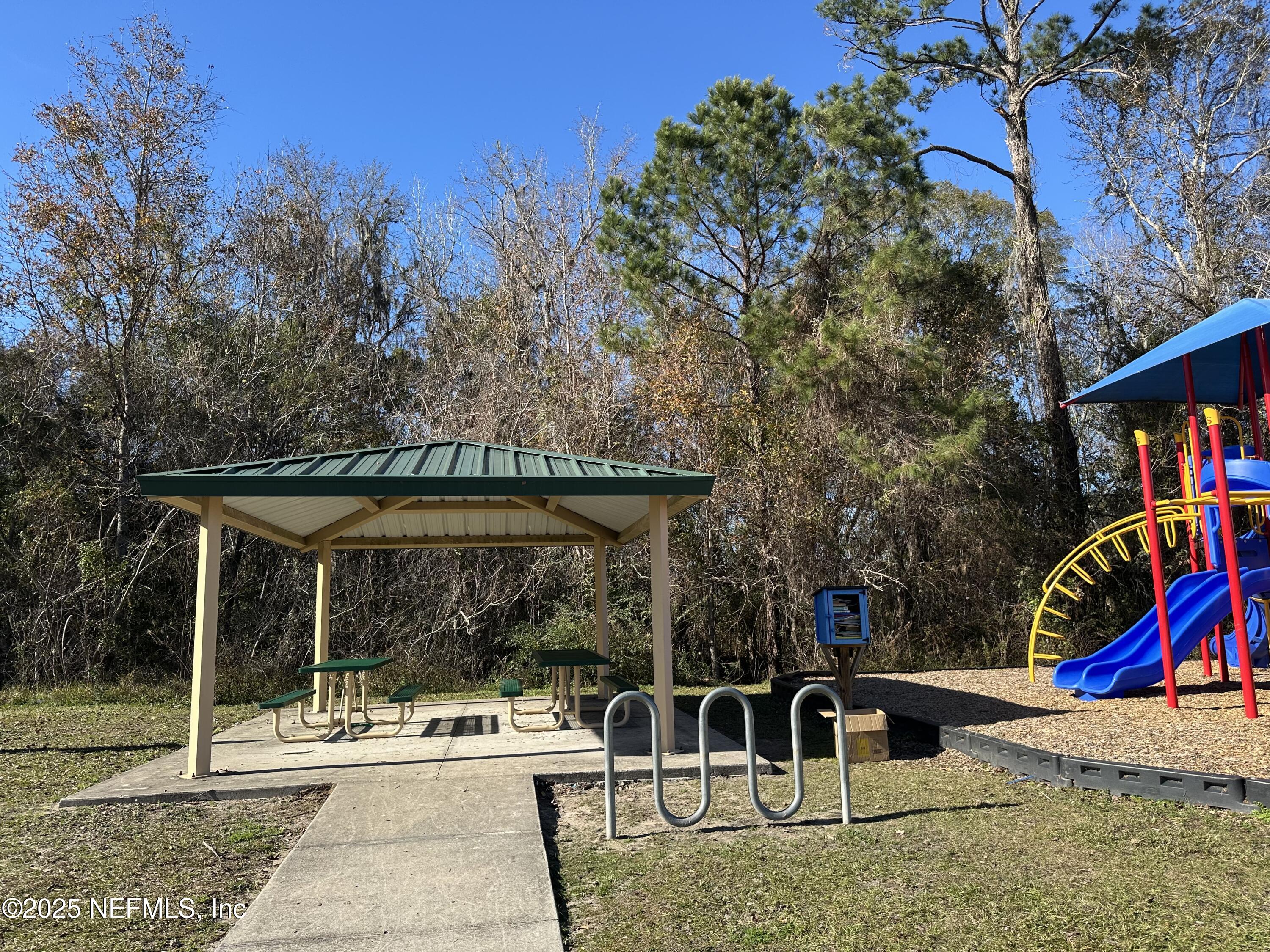 45575 Ingleham Circle Callahan, FL 32011 - Photo 22 of 24 a view of outdoor space yard deck patio and swimming pool