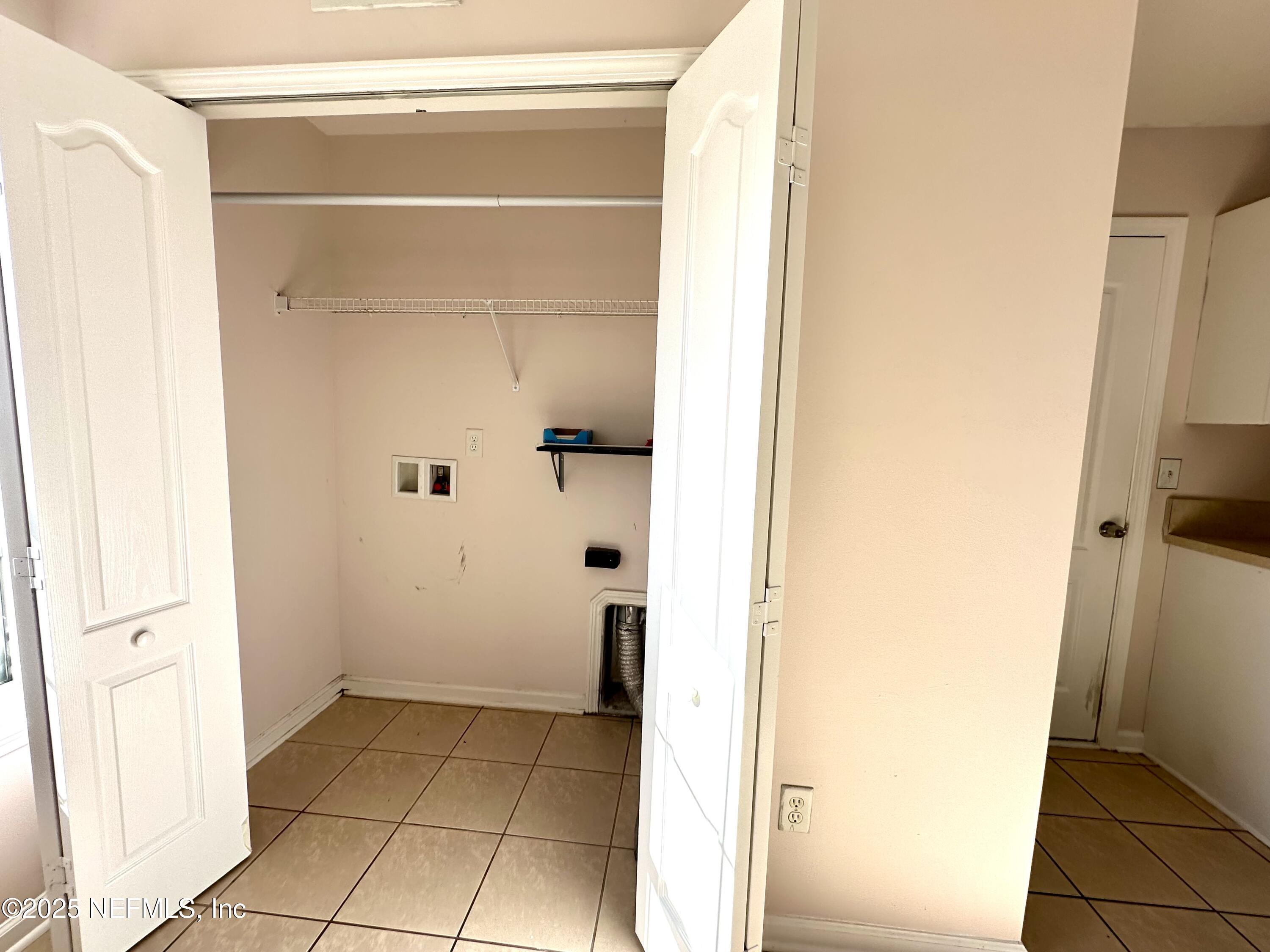 45575 Ingleham Circle Callahan, FL 32011 - Photo 4 of 24 a view of bathroom with a shower and a door