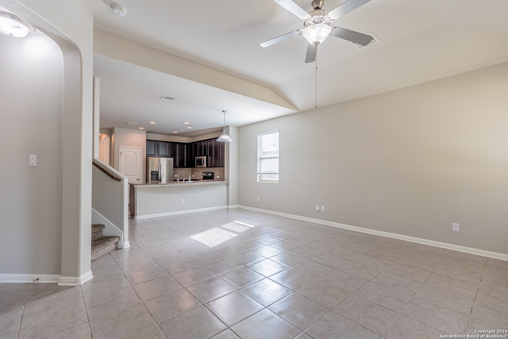 8527 Rolling Tree Converse, TX 78109 - Photo 13 of 40 a view of a kitchen with furniture and a ceiling fan