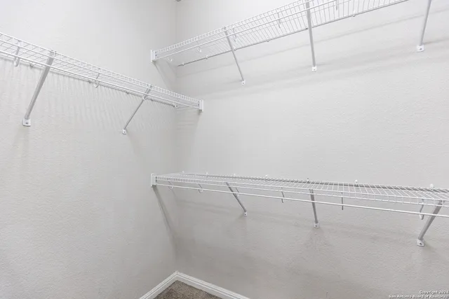 a view of a room with racks on the wall