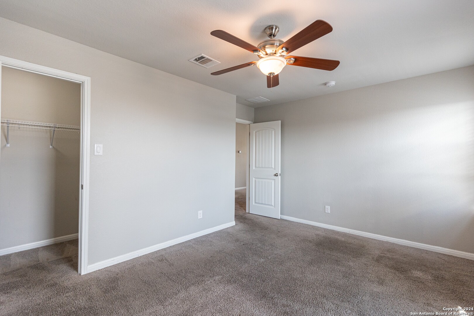 8527 Rolling Tree Converse, TX 78109 - Photo 27 of 40 an empty room with a ceiling fan and a fan