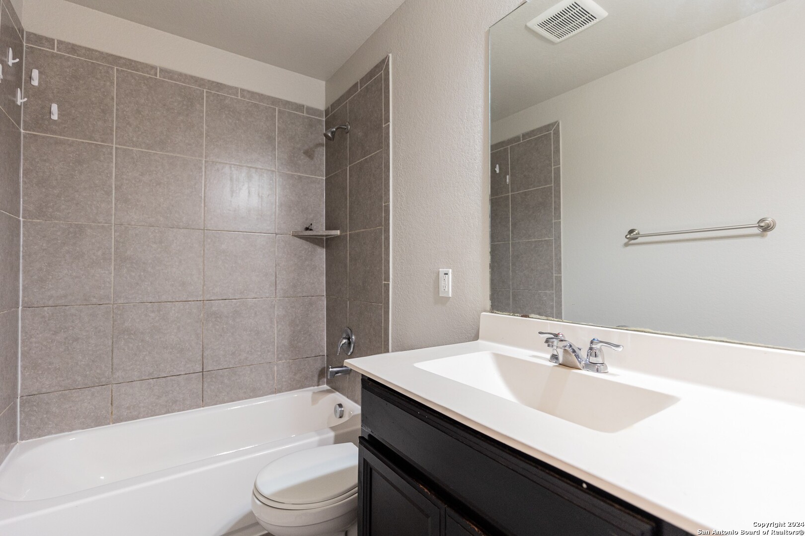 8527 Rolling Tree Converse, TX 78109 - Photo 28 of 40 a bathroom with a sink a toilet and a bathtub