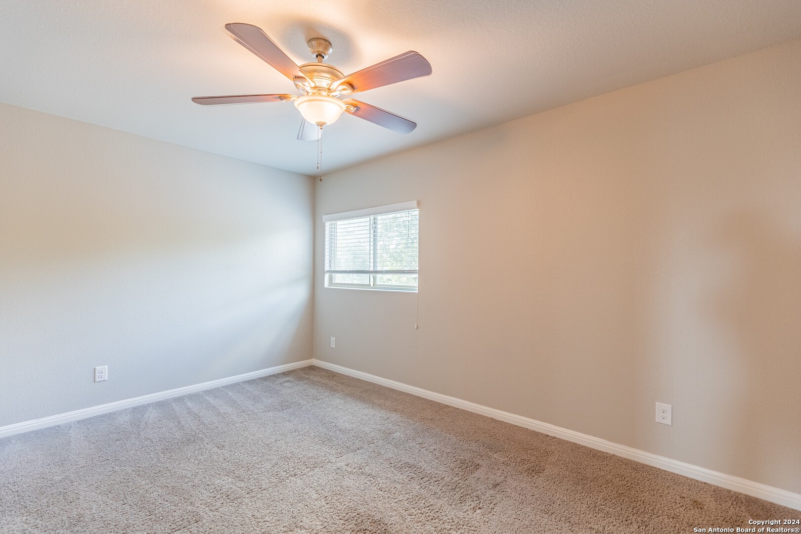 8527 Rolling Tree Converse, TX 78109 - Photo 29 of 40 an empty room with a window and a fan