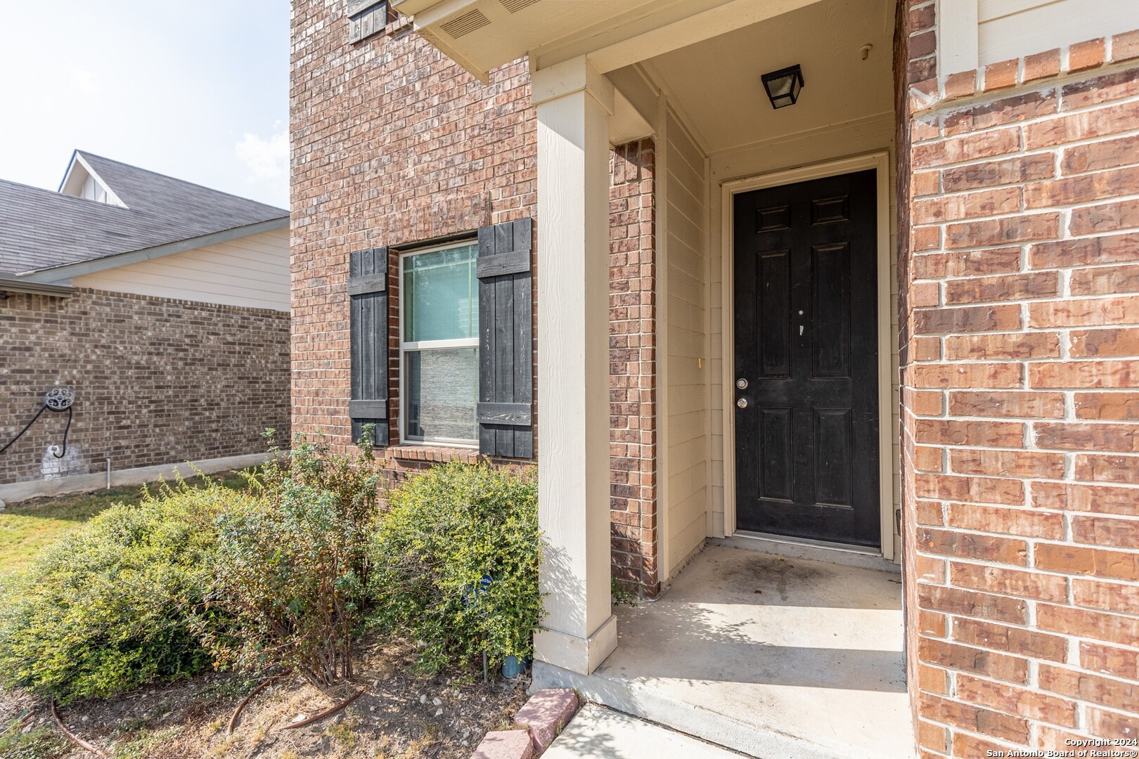 8527 Rolling Tree Converse, TX 78109 - Photo 4 of 40 a view of a brick house with potted plants