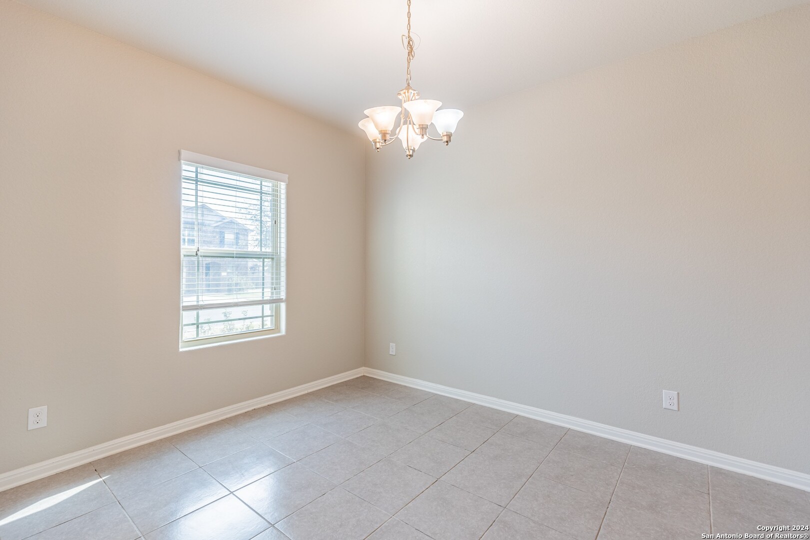 8527 Rolling Tree Converse, TX 78109 - Photo 6 of 40 a view of a chandelier fan and a window in a room
